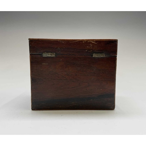 21 - A George III mahogany tea caddy, with oval inlaid patera panels, the cover opening to reveal two lid... 