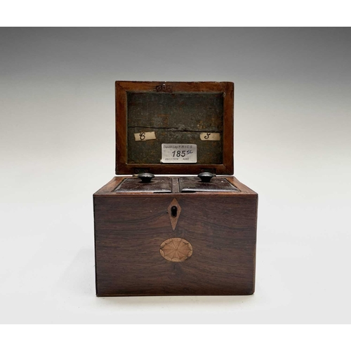 21 - A George III mahogany tea caddy, with oval inlaid patera panels, the cover opening to reveal two lid... 