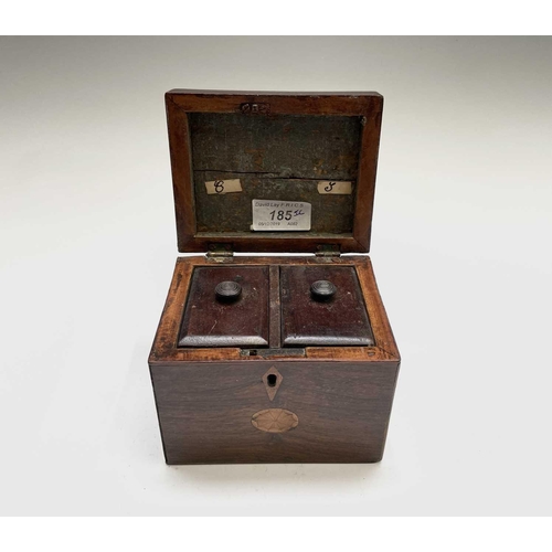 21 - A George III mahogany tea caddy, with oval inlaid patera panels, the cover opening to reveal two lid... 