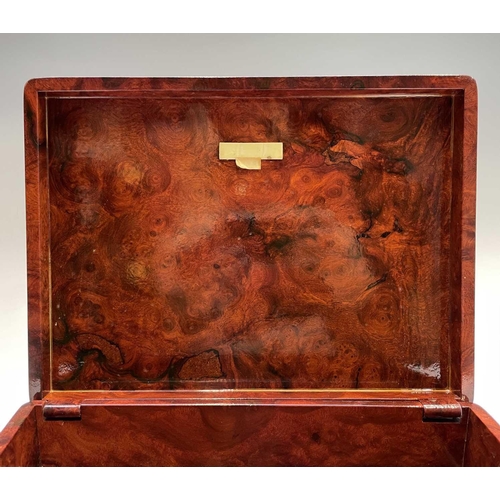 210 - A burr wood humidor. Height 7cm, width 30cm, depth 22cm.