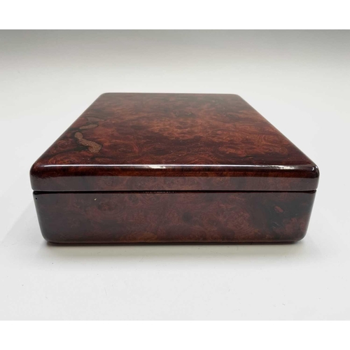 210 - A burr wood humidor. Height 7cm, width 30cm, depth 22cm.