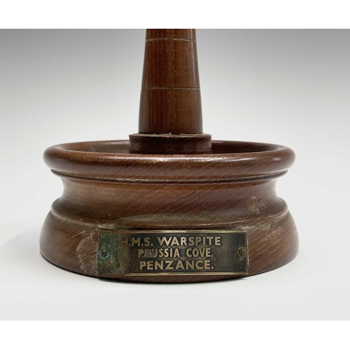 221 - A turned teak lighthouse from the timber of HMS Warspite and labelled Prussia Cove, Penzance, height... 