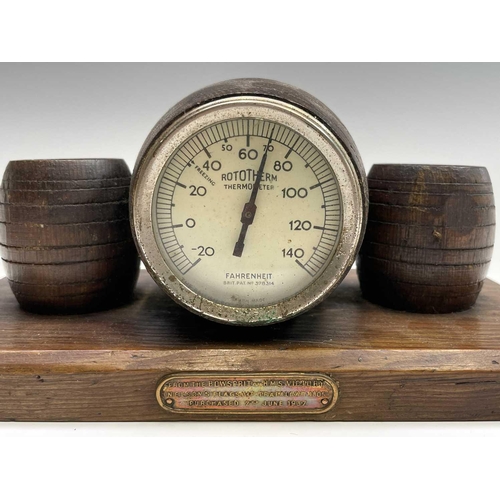 222 - HMS Victory, An oak cased 'Rototherm' thermometer, of barrel form, flanked by two barrel form match ... 