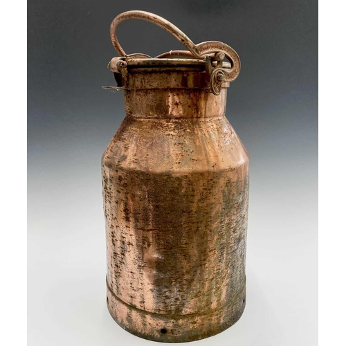 224 - A copper plated milk churn, the swing handle forming a locking device, height 63cm.