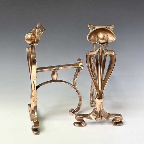 231 - A pair of Arts and Crafts copper firedogs, with stylised tulip uprights and whiplash tendrils, heigh... 