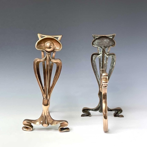 231 - A pair of Arts and Crafts copper firedogs, with stylised tulip uprights and whiplash tendrils, heigh... 