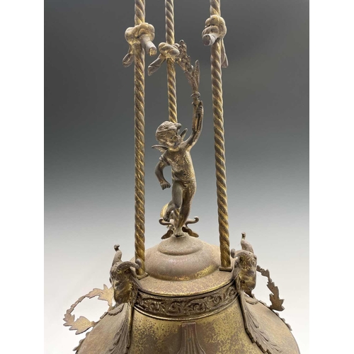 234 - A continental brass-finished tall electrolier, the central lamp with three branches surmounted by a ... 