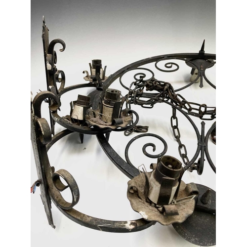 235 - A Gothic style wrought iron hanging electrolier, diameter 53cm, together with four similar twin bran... 