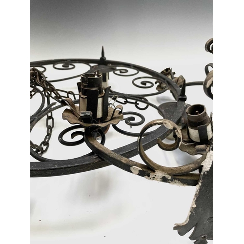 235 - A Gothic style wrought iron hanging electrolier, diameter 53cm, together with four similar twin bran... 