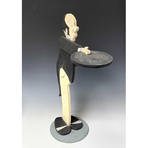 237 - A painted plywood dumb waiter, as a butler, on a circular base, height 87cm.