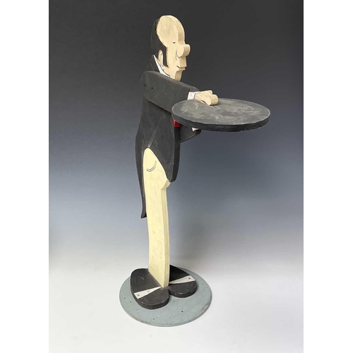 237 - A painted plywood dumb waiter, as a butler, on a circular base, height 87cm.