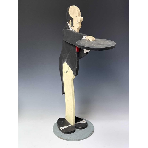 237 - A painted plywood dumb waiter, as a butler, on a circular base, height 87cm.