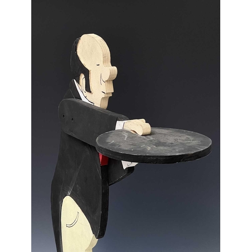 237 - A painted plywood dumb waiter, as a butler, on a circular base, height 87cm.