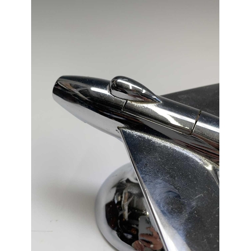 24 - A Dunhill 'Sabre' jet fighter table lighter, 1950s, with chrome finish, on a domed base, length 16.5... 