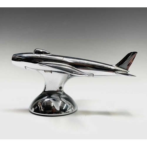 24 - A Dunhill 'Sabre' jet fighter table lighter, 1950s, with chrome finish, on a domed base, length 16.5... 