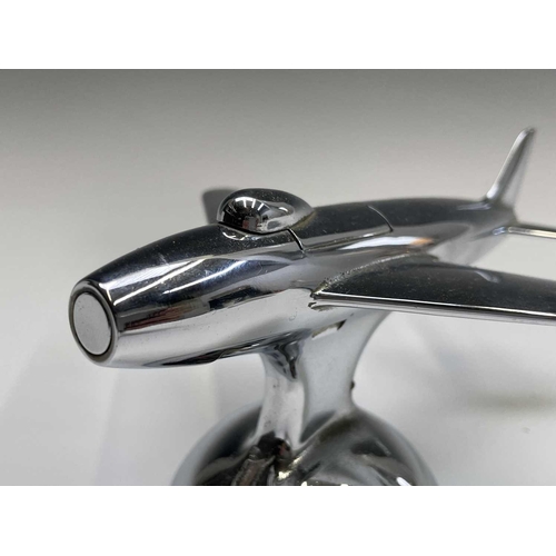 24 - A Dunhill 'Sabre' jet fighter table lighter, 1950s, with chrome finish, on a domed base, length 16.5... 