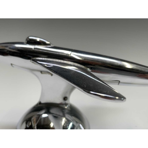 24 - A Dunhill 'Sabre' jet fighter table lighter, 1950s, with chrome finish, on a domed base, length 16.5... 