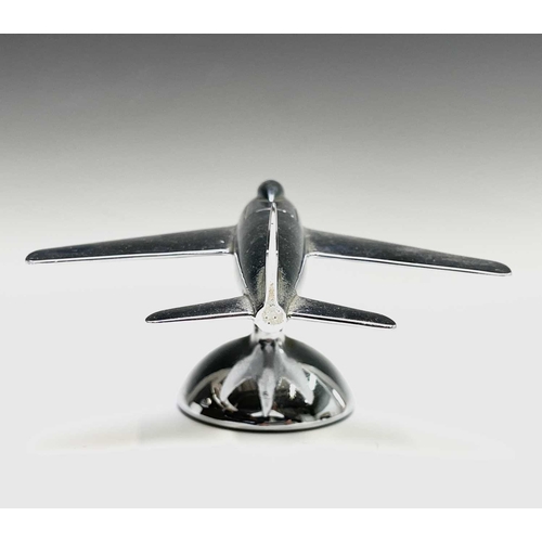 24 - A Dunhill 'Sabre' jet fighter table lighter, 1950s, with chrome finish, on a domed base, length 16.5... 