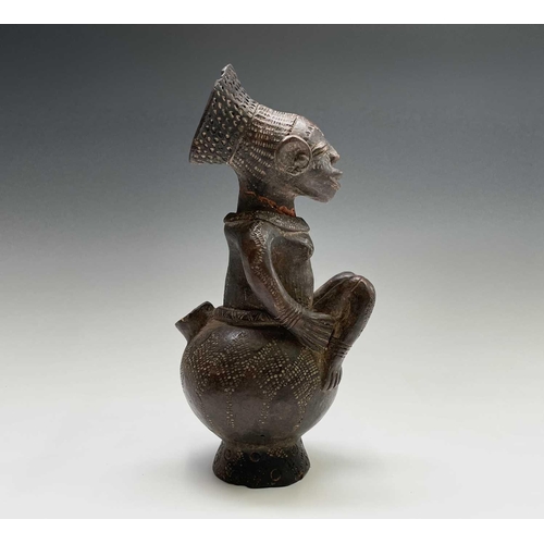 243 - Two African (Mangbetu) pottery figural vessels, the tallest 27cm high, and one other pottery figure ... 