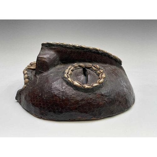 244 - A 19th century African tribal mask, with applied snakeskin and cowrie shell decoration, height 27.5c... 