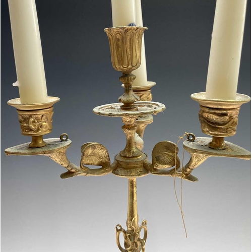 25 - A pair of gilt metal ornate candelabra, probably French, circa 1890, each with a central sconce and ... 