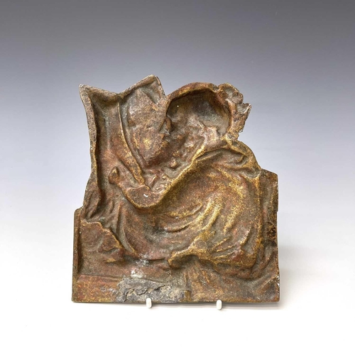 252 - A Victorian brass plaque, cast as a philosopher reading a book, height 18cm.