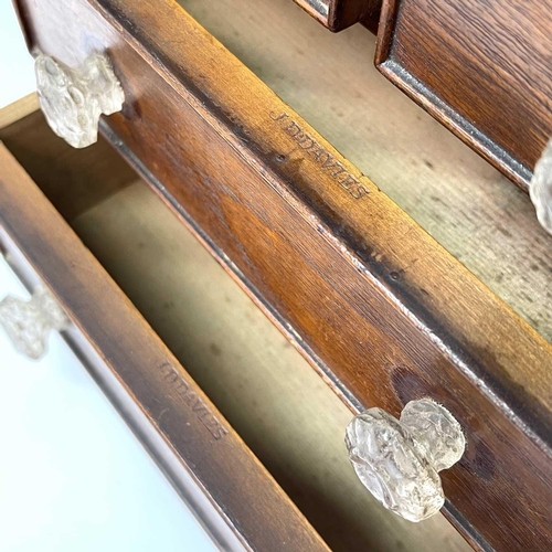 253 - A Victorian walnut apprentice chest of two short and two long drawers, with twist turned stiles, sta... 