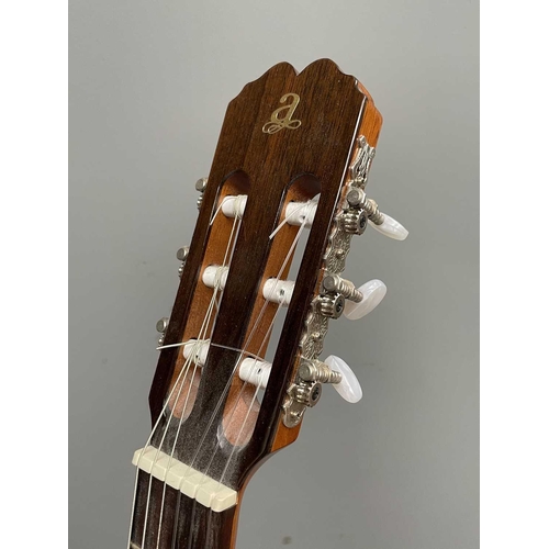 257 - An Admira Spanish-type classical guitar with stand and soft case.