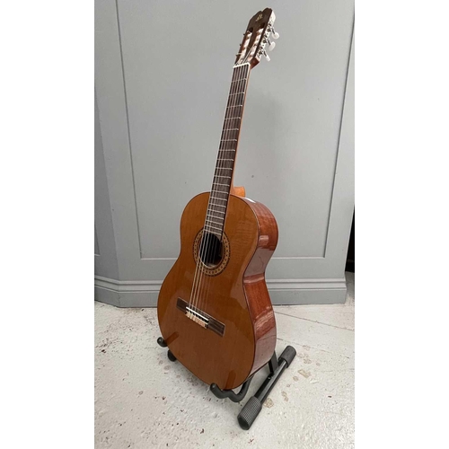 257 - An Admira Spanish-type classical guitar with stand and soft case.