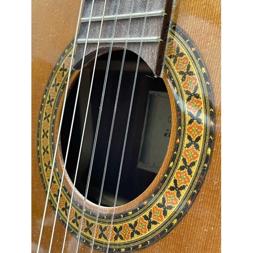 257 - An Admira Spanish-type classical guitar with stand and soft case.