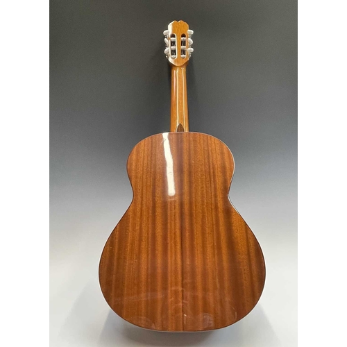 257 - An Admira Spanish-type classical guitar with stand and soft case.