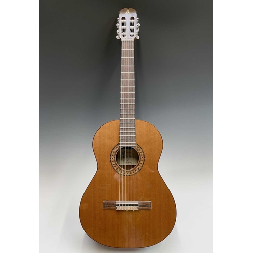 257 - An Admira Spanish-type classical guitar with stand and soft case.