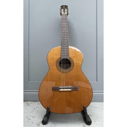 257 - An Admira Spanish-type classical guitar with stand and soft case.