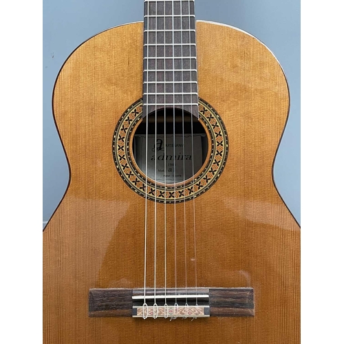 257 - An Admira Spanish-type classical guitar with stand and soft case.