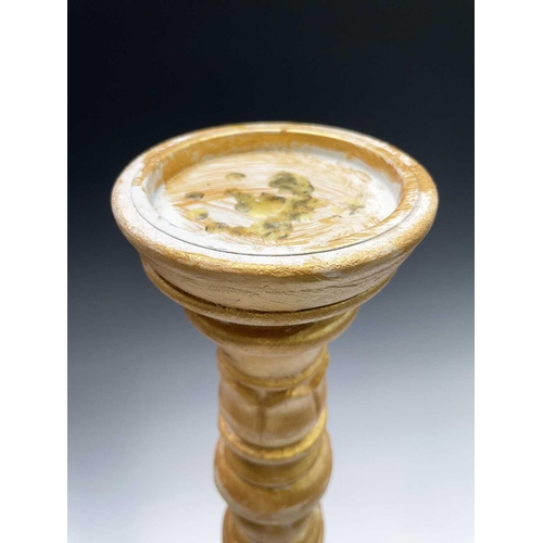 269 - A pair of large gold painted candle stands. Height 64cm.