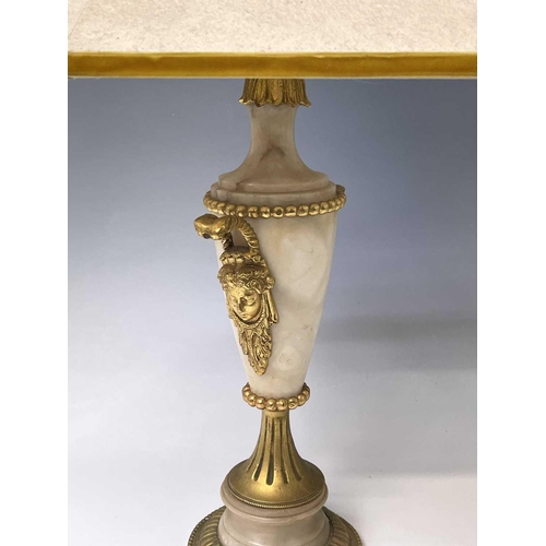 27 - An ornate alabaster table lamp, early 20th century, with gilt metal mask handles and mounts, height ... 