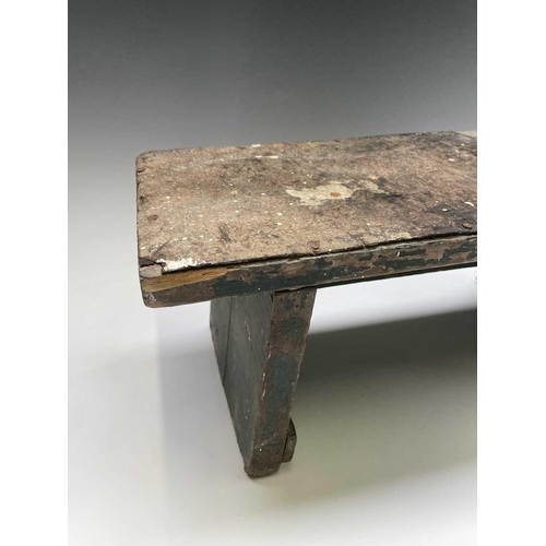 271 - A primitive green painted stool, together with a hardwood and wrought iron stand (2).