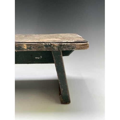 271 - A primitive green painted stool, together with a hardwood and wrought iron stand (2).