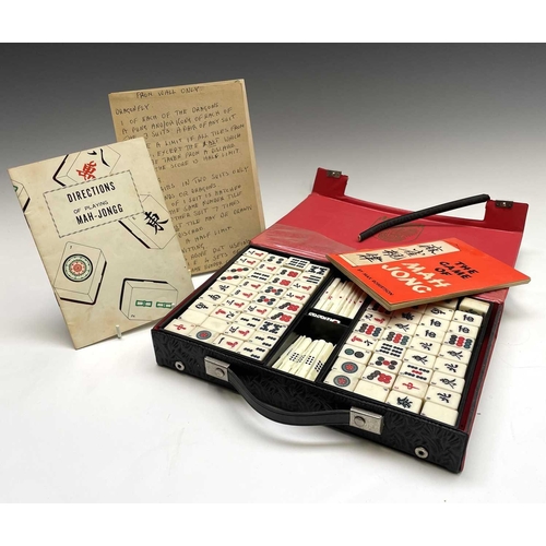 280 - A Dragon mah jong set, with bamboo backed tiles and complete with instructions, width 28.5cm. Proven... 