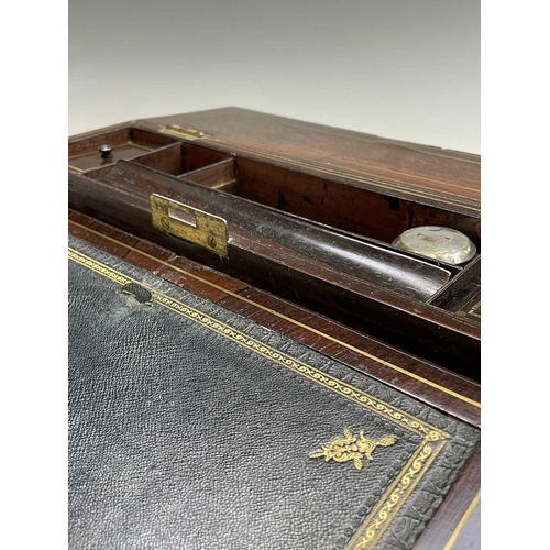 281 - A good quality early Victorian rosewood fold top writing box, with cut brass inlaid decoration, the ... 