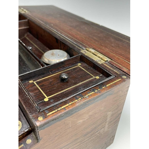 281 - A good quality early Victorian rosewood fold top writing box, with cut brass inlaid decoration, the ... 