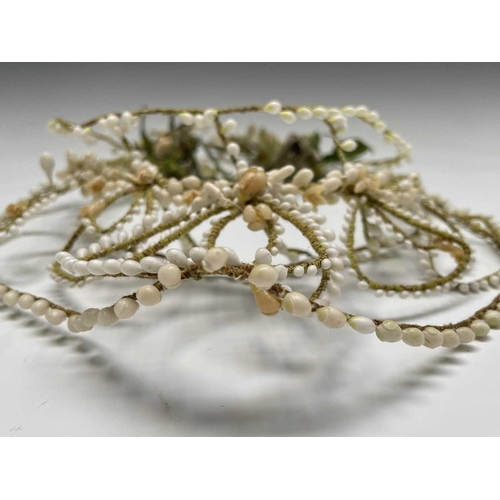 2810 - Wedding Attire - A circa 1920s/30s bridal headpiece with wax flower decoration. Height 33cm overall.