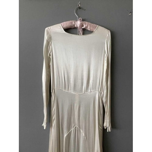 2811 - A 1920s ivory silk satin wedding dress, approximate size 6-8.