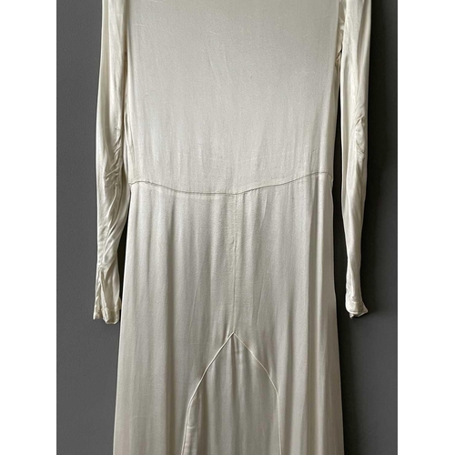 2811 - A 1920s ivory silk satin wedding dress, approximate size 6-8.