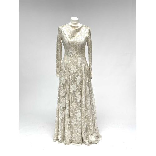 2812 - A 1950s wedding dress, duchess satin overlaid with cotton lace, approximate size 10.