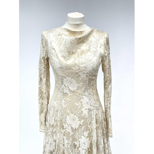 2812 - A 1950s wedding dress, duchess satin overlaid with cotton lace, approximate size 10.