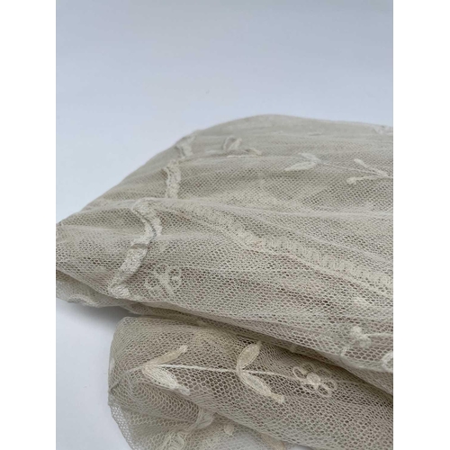 2813 - Wedding Attire - A circa 1930s tulle wedding veil with floral embroidery. Length 250cm, maximum widt... 