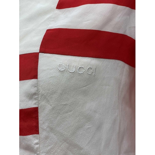 2816 - A 1970s Gucci red and white striped 100% silk blouse with embroidered logo, label size 38.