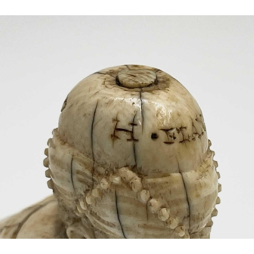 282 - A 19th century Dieppe ivory figure of a bearded man wearing a turban squatting, inscribed and dated ... 