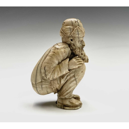 282 - A 19th century Dieppe ivory figure of a bearded man wearing a turban squatting, inscribed and dated ... 